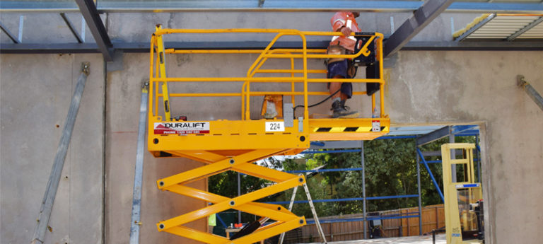worker at 19-foot-scissor-lift - Duralift